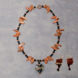 Necklace and earrings made with Black Onyx and Goldstone