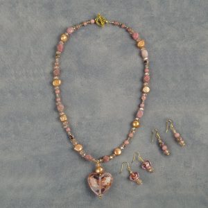 This set is made with Rhodonite, crystals, and pearls