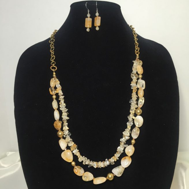 Necklace and earrings set made with on chain of bronze crystals