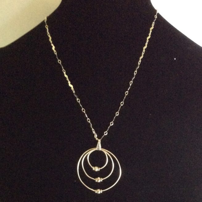 Silver plate circular accent necklace